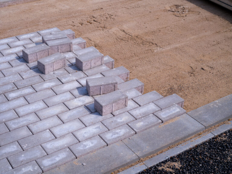 many Paving stones are laid for a new sidewalk